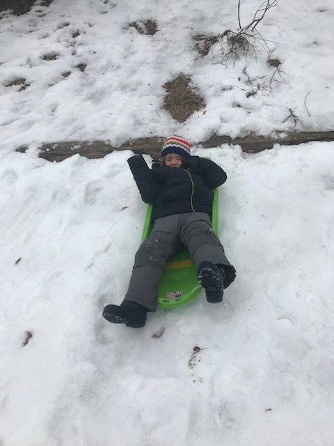 child 2 sledding
