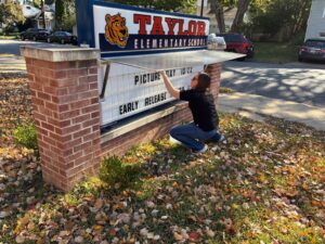 Molly Massey changes the message on the Taylor Marquis