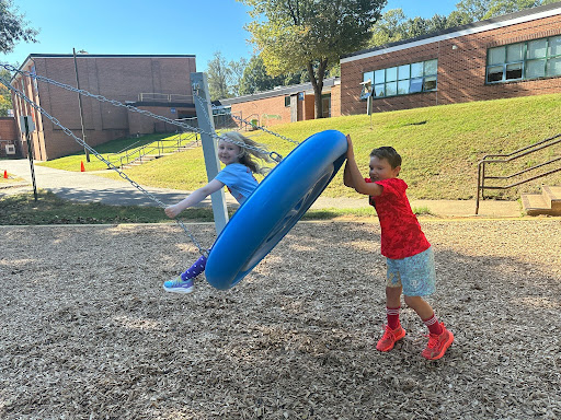 trying out the new swing on the upper grade playground
