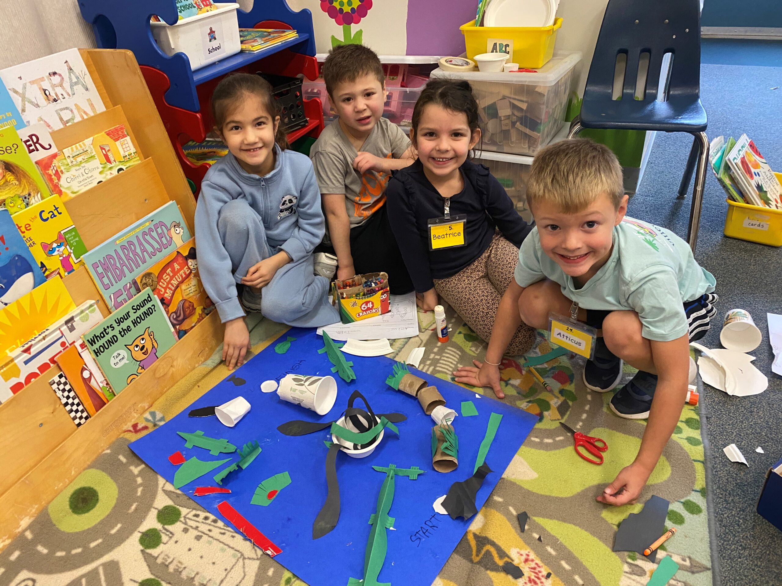 kindergarten students show off their project